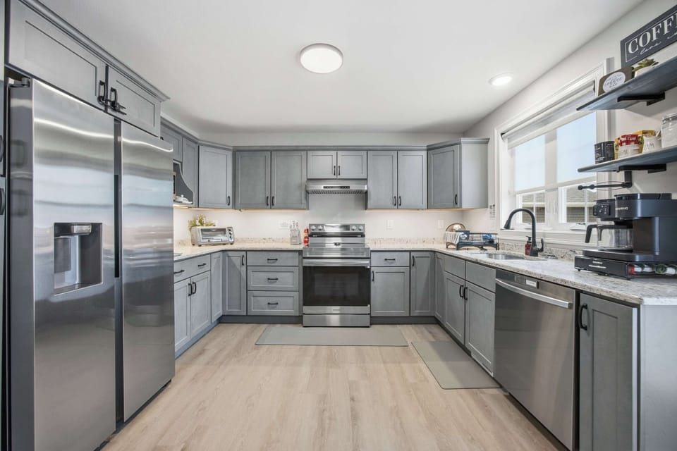 Gray shaker cabinets, stainless steel appliances, and everything you need to cook a real meal together.