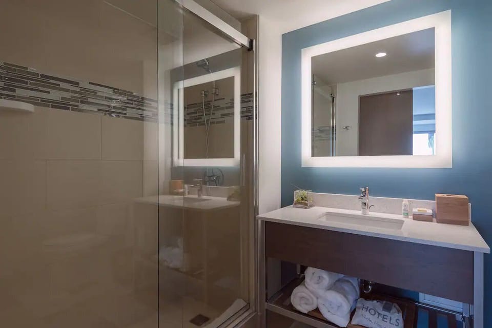 Start the day with a glowing mirror and fresh towels.