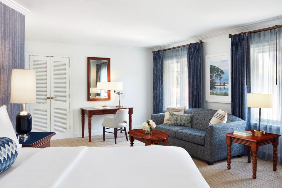Unwind in a spacious bedroom with cozy seating nook.