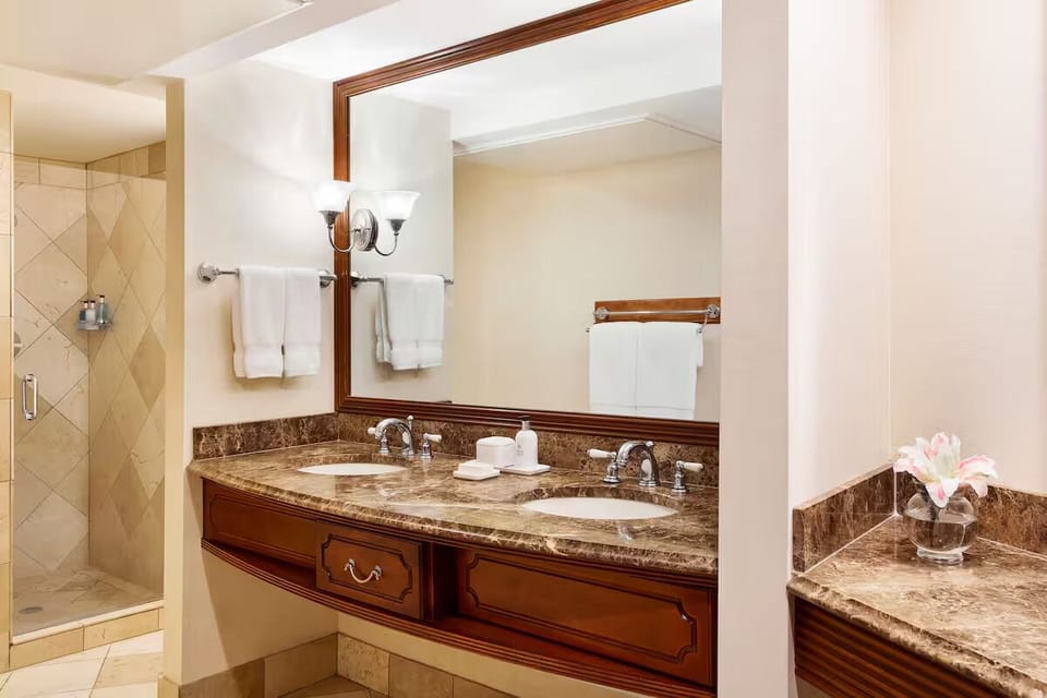 Pamper yourself at the double vanity with plush towels.