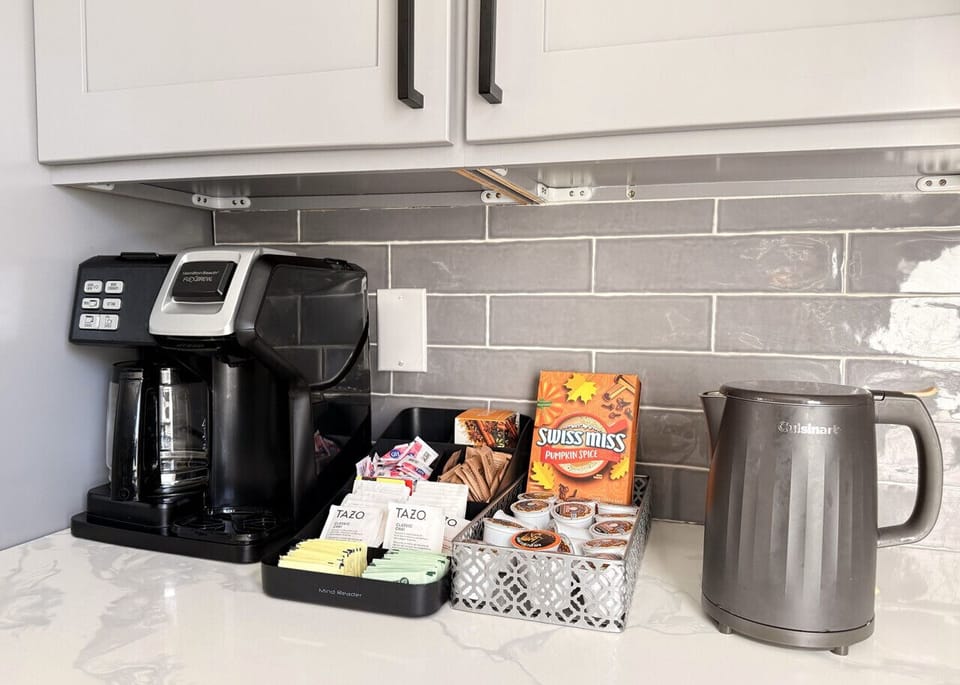 Complete coffee station featuring both a Keurig machine and traditional drip coffee maker. We provide K-cup pods, cream, brown and white sugar, zero-calorie sweeteners, and a variety of teas. Everything you need for the perfect morning brew