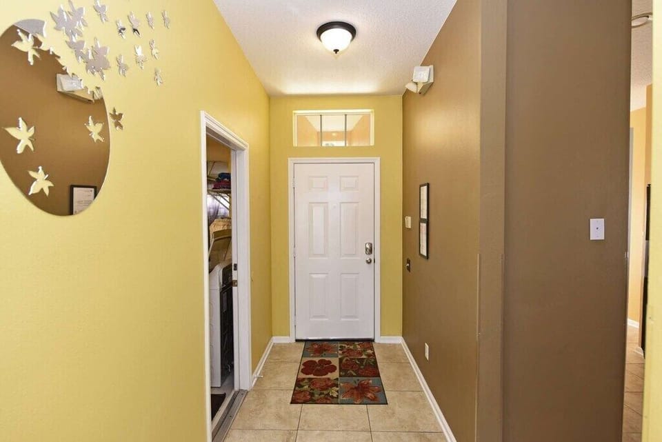 Inviting hallway with elegant decor and warm lighting.