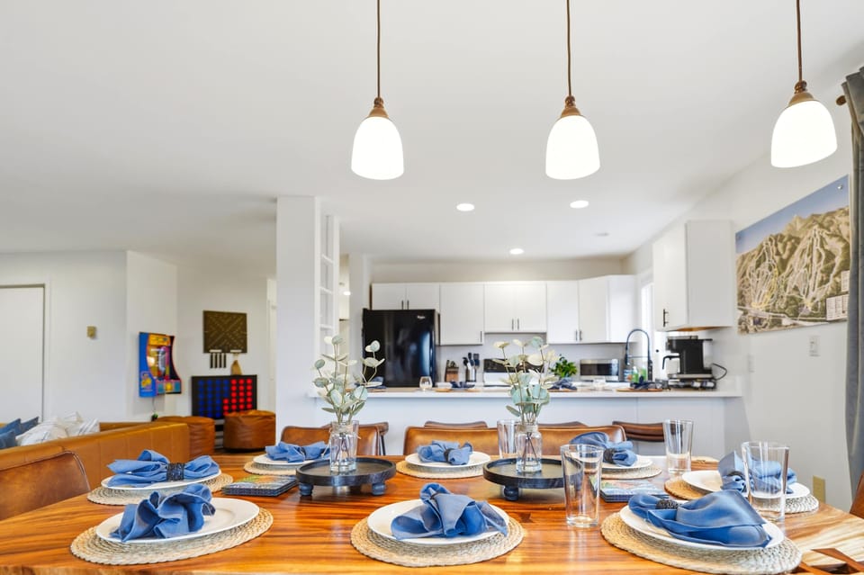 The open kitchen and dining area together — plenty of room to cook, gather, and eat without anyone feeling far from the action.