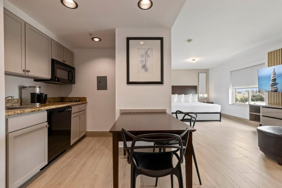 Enjoy seamless open-concept living from dining to dreamy bed.