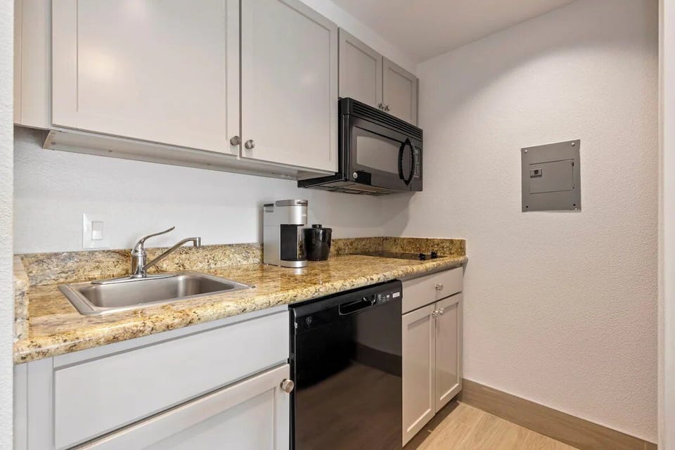 Prep quick snacks on granite counters with handy appliances.