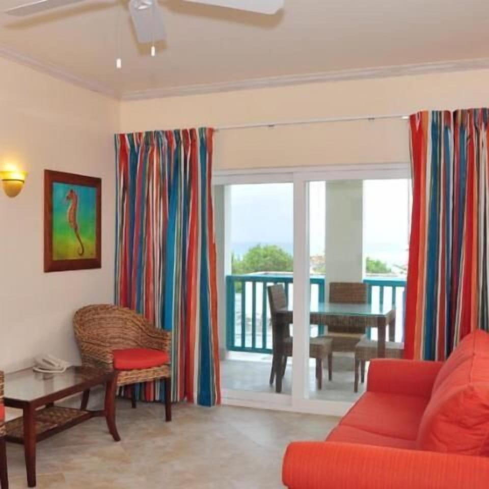 Unwind on the sofa, then step onto the breezy balcony.