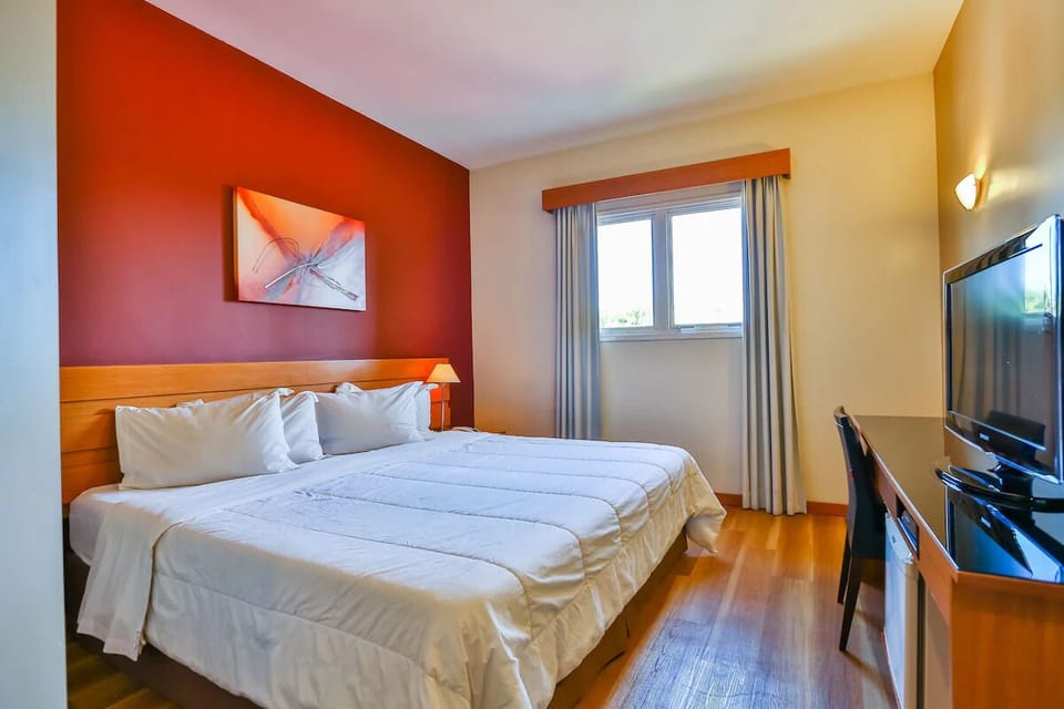Unwind in a bright, cozy room with crisp linens.