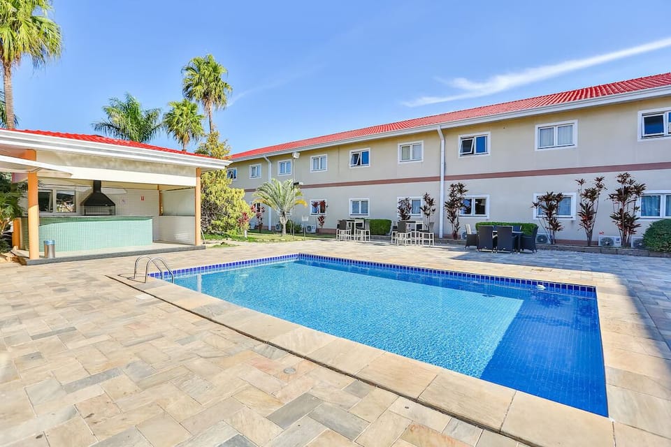 Dive into sparkling sunshine by the serene courtyard pool.