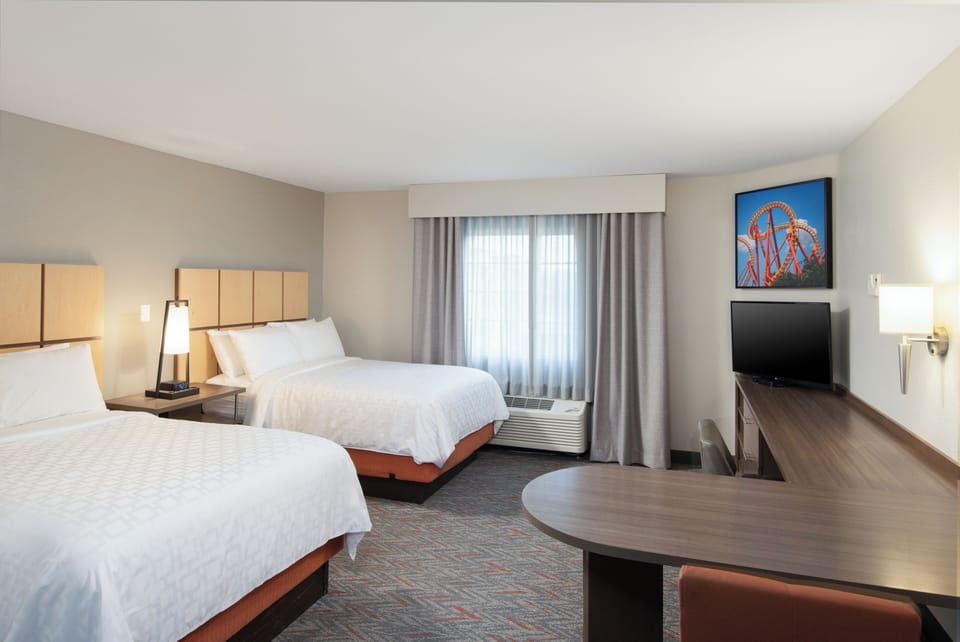 Unwind in plush beds with bright, calming room space.