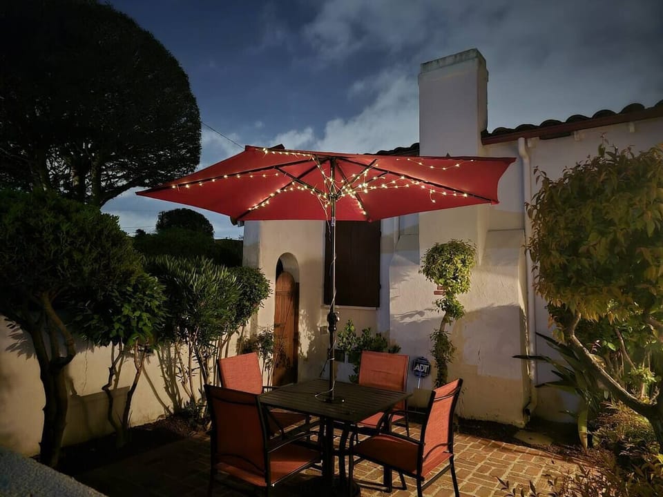 Relax outdoors in a peaceful yard surrounded by greenery.