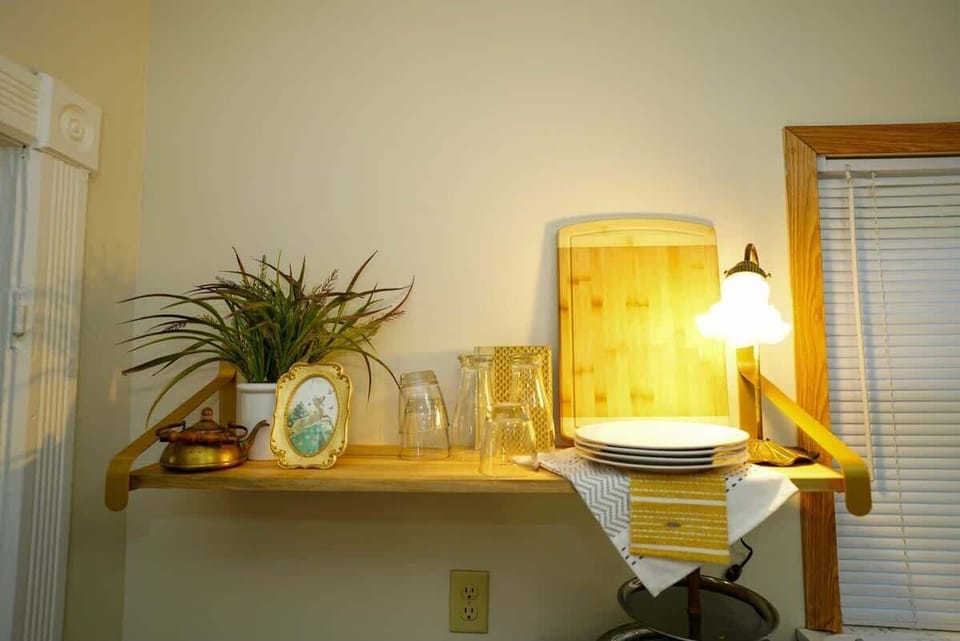 Kitchen shelving with glasses and cutting board
