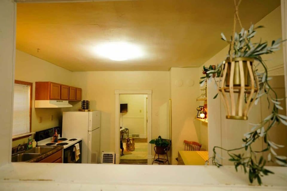 Looking from the bedroom hallway into the front of the apartment