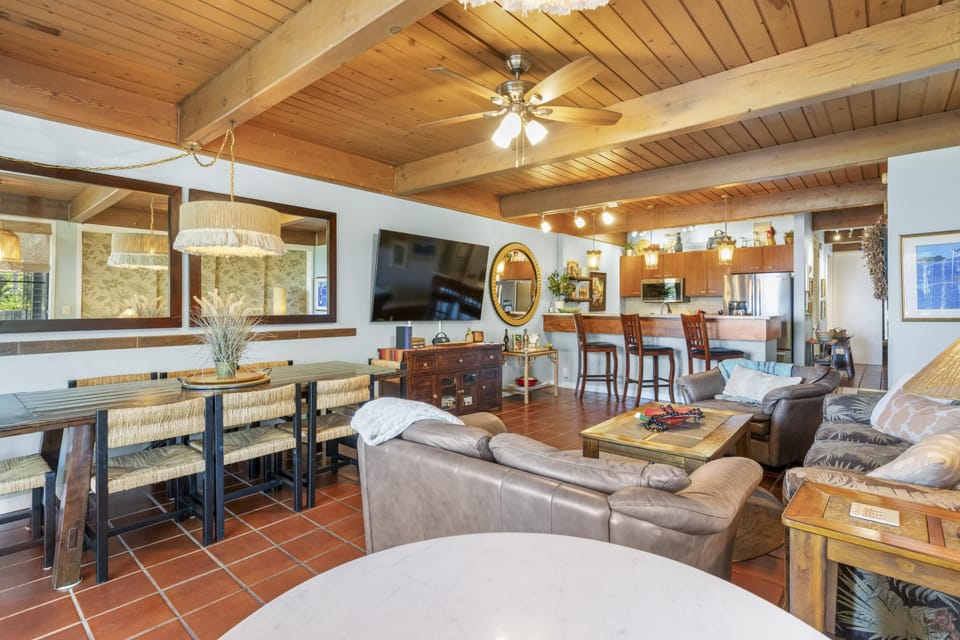 Spacious living room with cozy seating and rustic charm