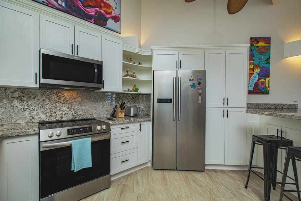 Enjoy the fully equipped kitchen with stainless steel appliances.