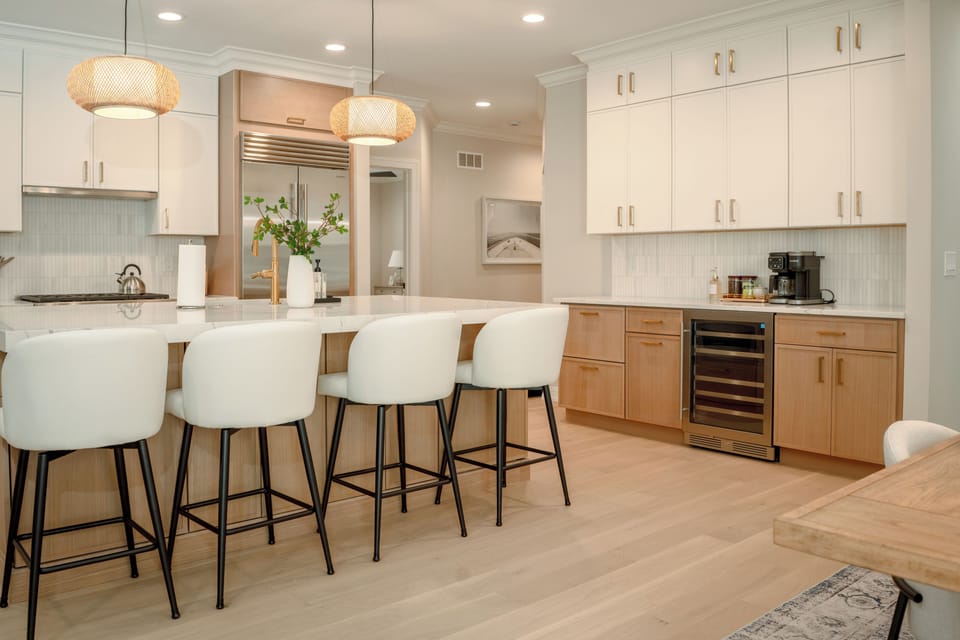 A chef's dream with high end appliances, coffee bar & wine fridge.