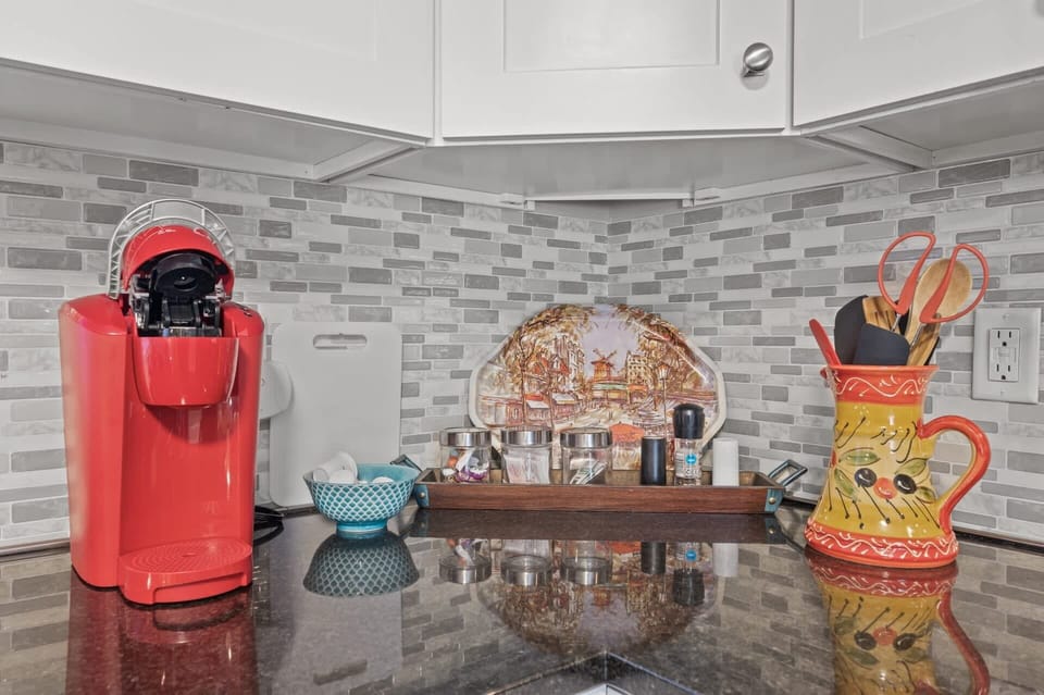 Coffee station close-up w/ counter space, colorful accents & an inviting morning setup.