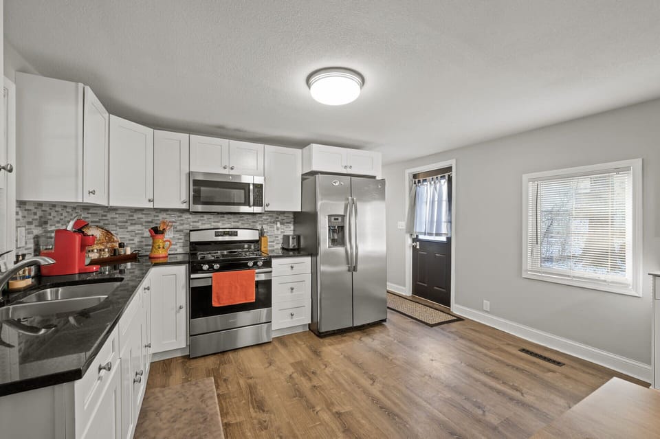 Spacious kitchen view showing ample counters, modern appliances & room to move comfortably.