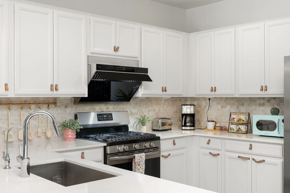 Clean, spacious kitchen with drip coffee maker for easy mornings before game day