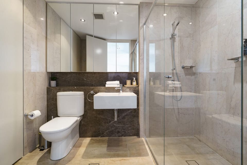A modern and spacious bathroom with elegant finishes and a walk-in shower for a refreshing start to the day.