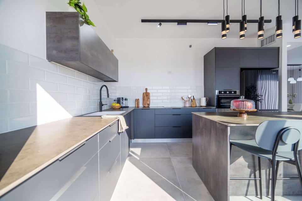 Sun-washed preparation zone blends modern finishes with functional flow.