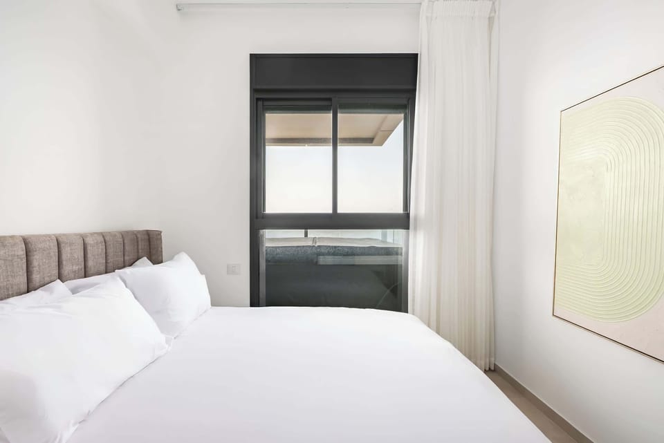 Wake slowly with filtered daylight, then step outside to discover nearby beaches, cafés, and scenic walks.