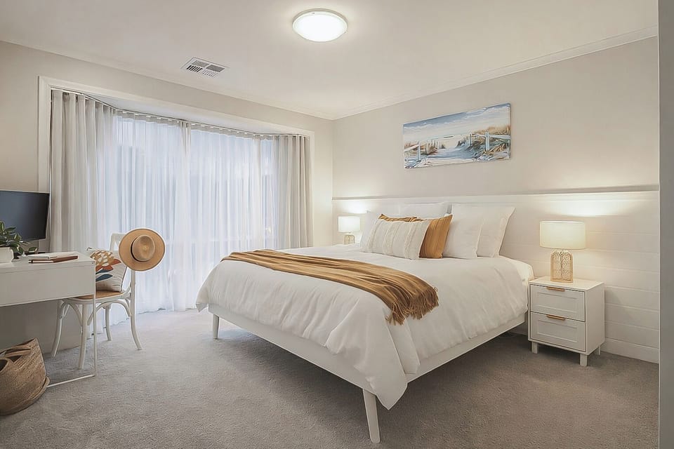 King bed in master bedroom with ensuite bathroom