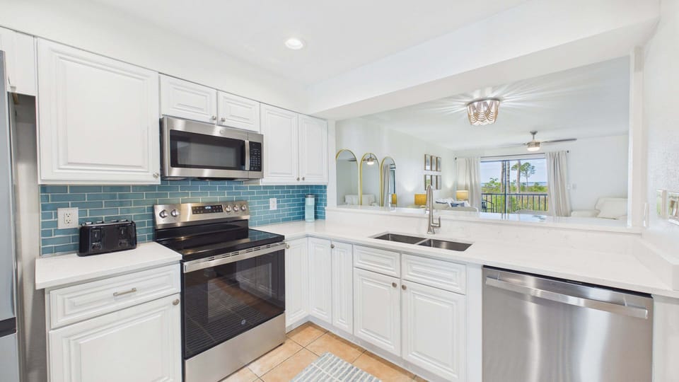 Full kitchen with stainless appliances and all the cooking essentials