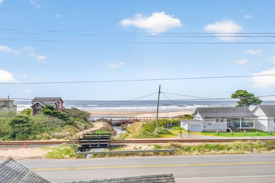 Coastal neighborhood with charming beachfront homes and direct beach access just steps away.