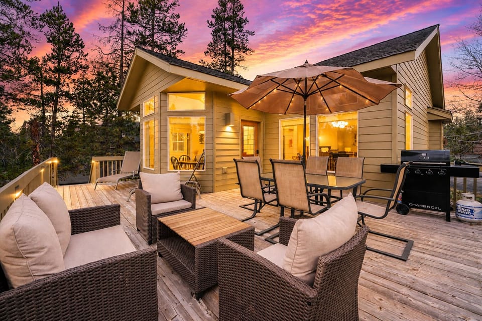 Spacious sunset deck with lounge seating, dining area, and grill