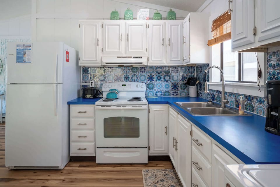 Kitchen looks out onto deck