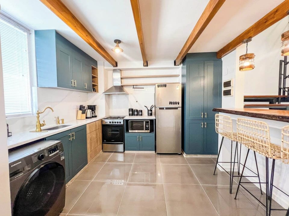 [Kitchen] "Fully equipped kitchen with everything you need—plus a convenient all-in-one washer/dryer. Cook, clean, and relax in style