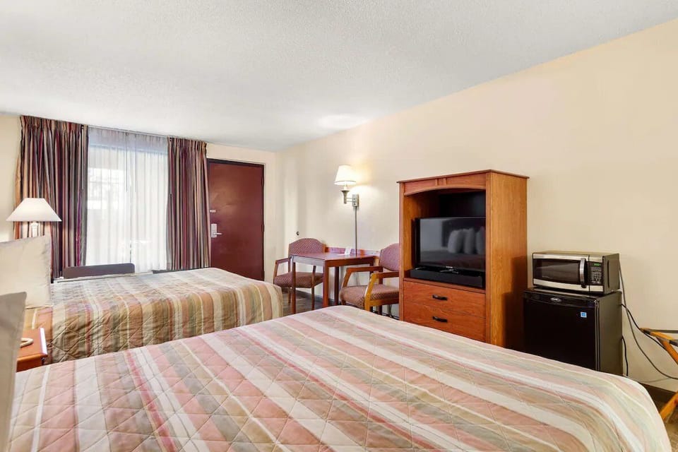 Wake up to natural light in a spacious double-bed room.