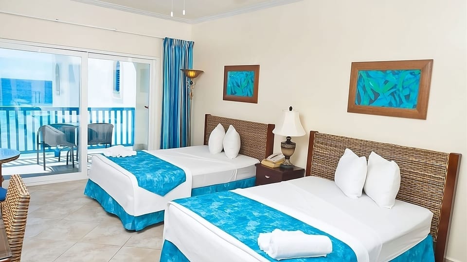 Drift off comfortably in twin beds beside the sunny balcony.