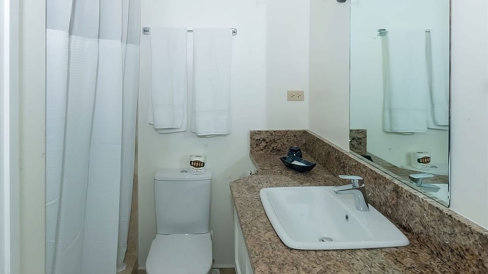 Refresh easily with a bright vanity and spotless shower.