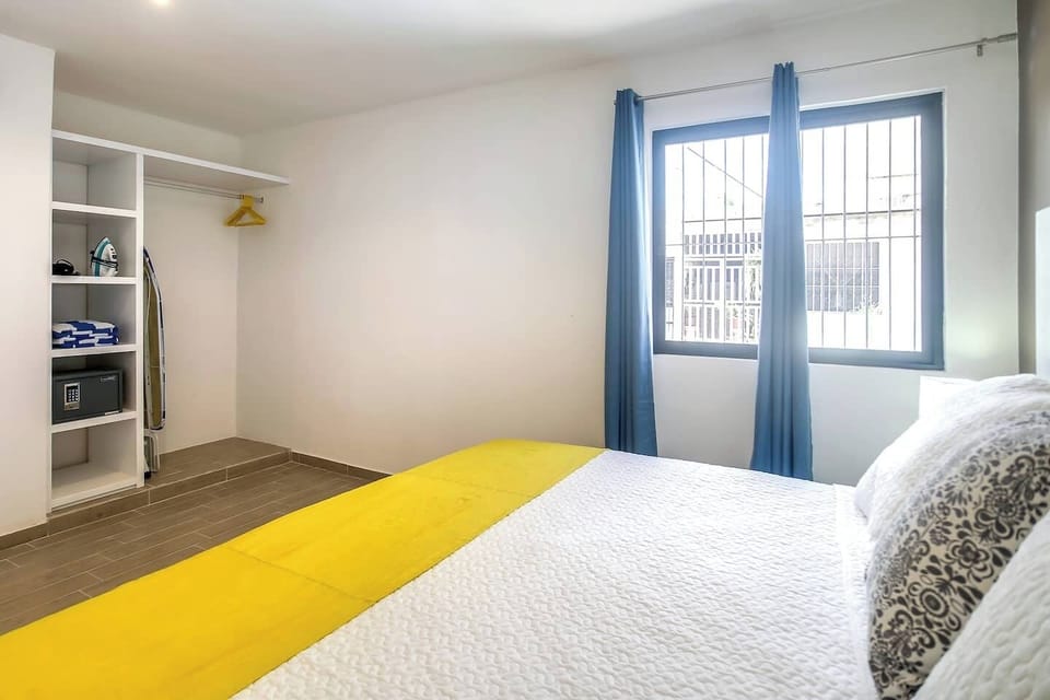 King bed, hair dryer, iron and security box in the bedroom