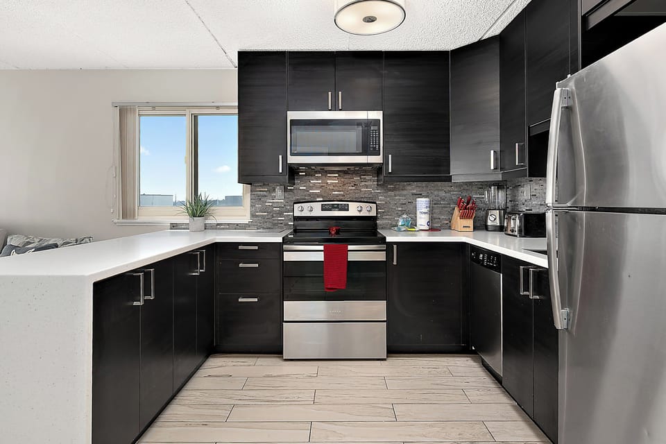 Generous counter space, full-size appliances, and a smart layout. This kitchen is built for more than just reheating leftovers.