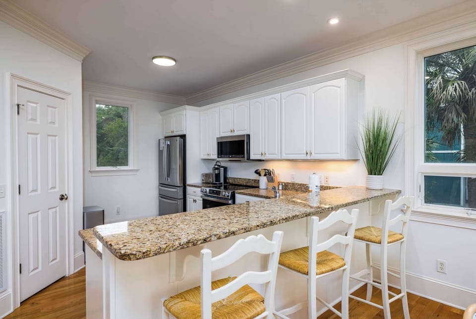 Dining Area with Island Bar and Kitchen