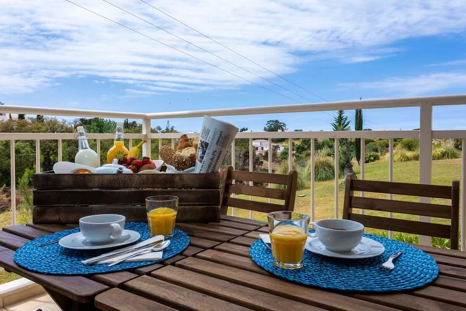 Savor sunrise breakfast on the balcony with peaceful views.