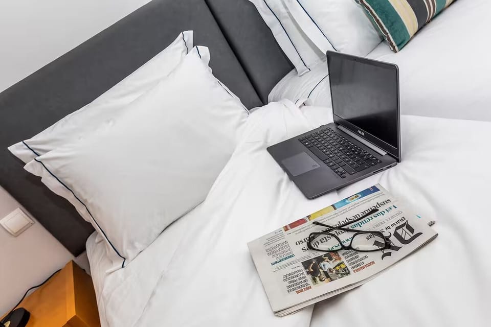 Settle in with fresh linens and a quiet reading moment.