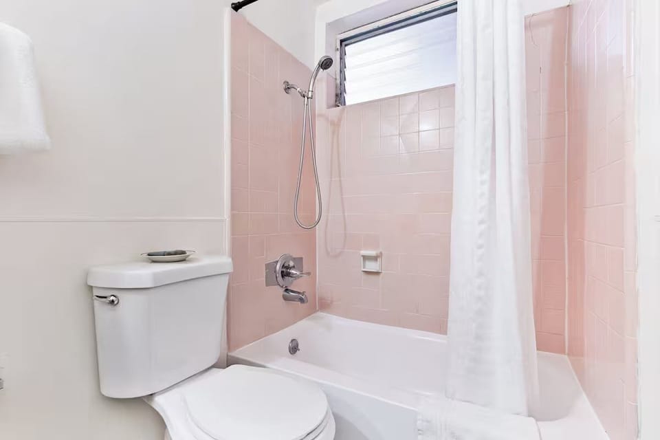 Rinse off after exploring in a clean tub-shower combo.