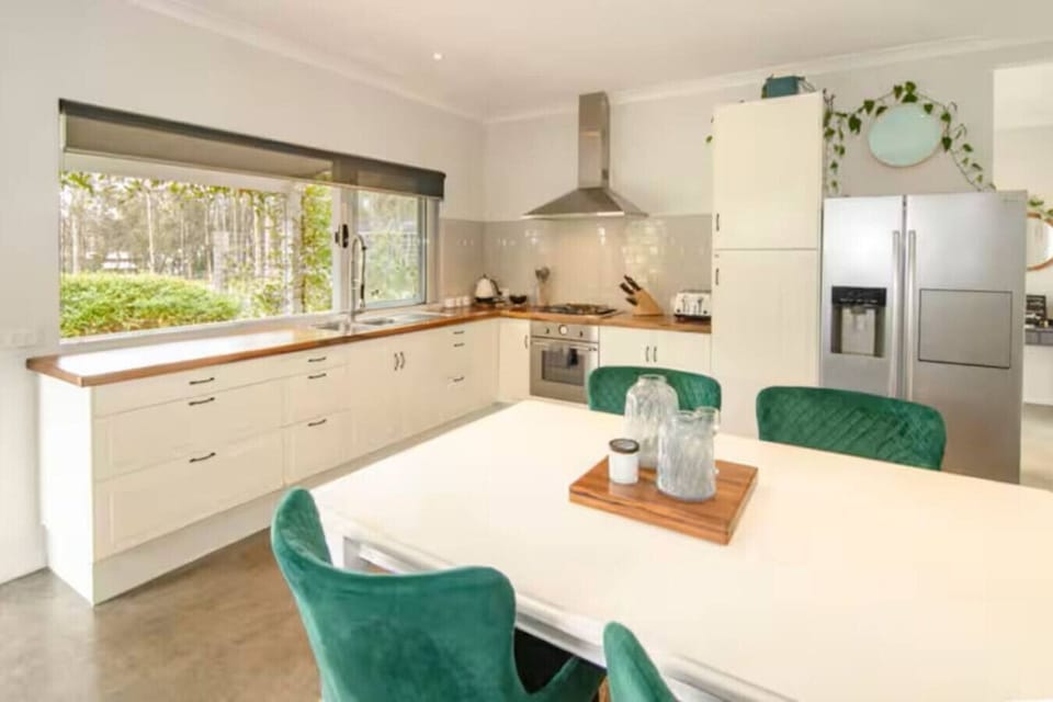 Fully Equipped Kitchen overlooking lawn and deck