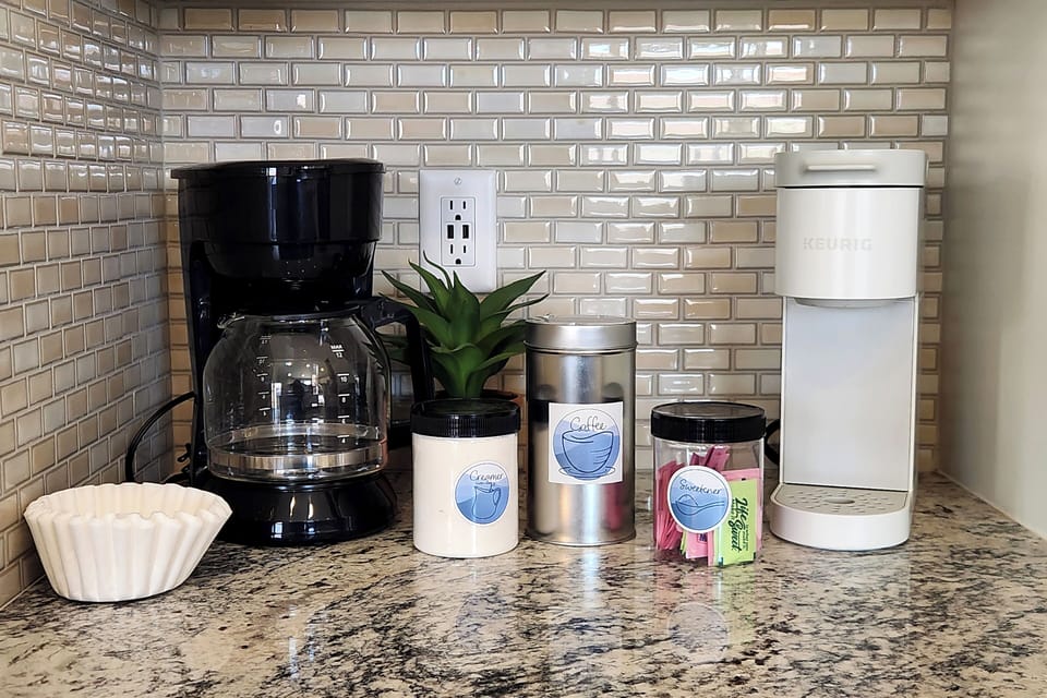 Coffee, coffee filters, creamer, sweeteners, tea, coffee maker, and Keurig. 