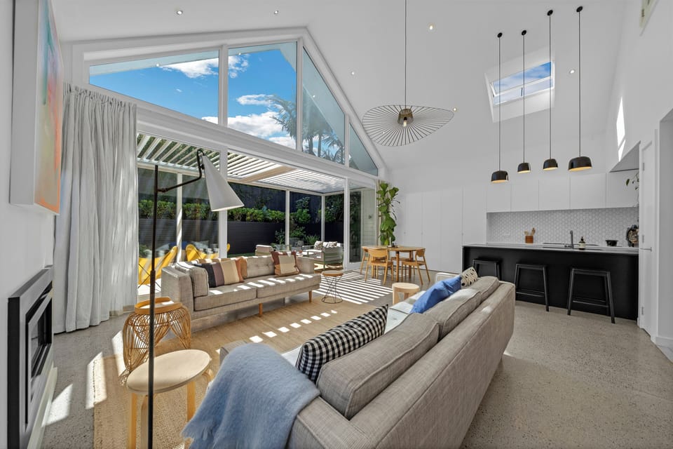 Living room with vaulted ceiling & natural light