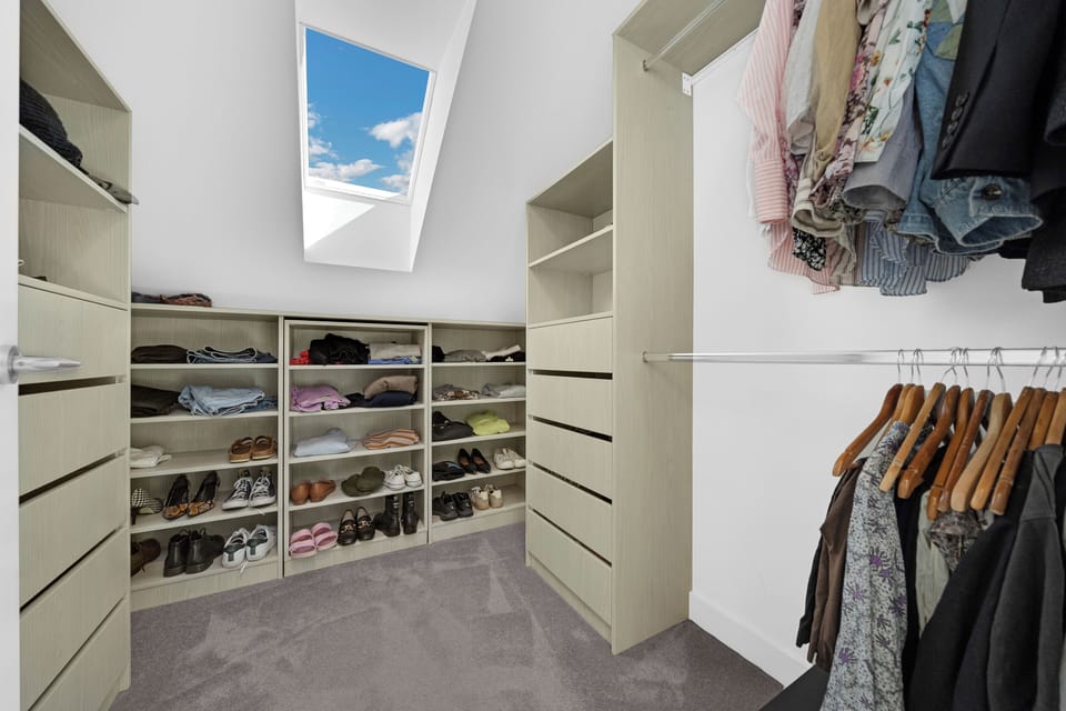 Spacious walk-in wardrobe with shelving