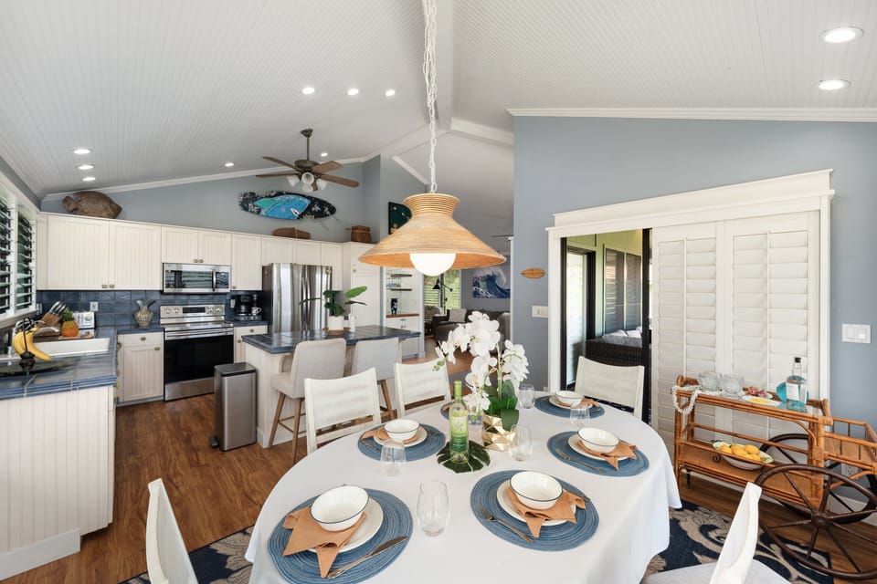 Dining area flowing into the kitchen, ideal for gathering and entertaining.
