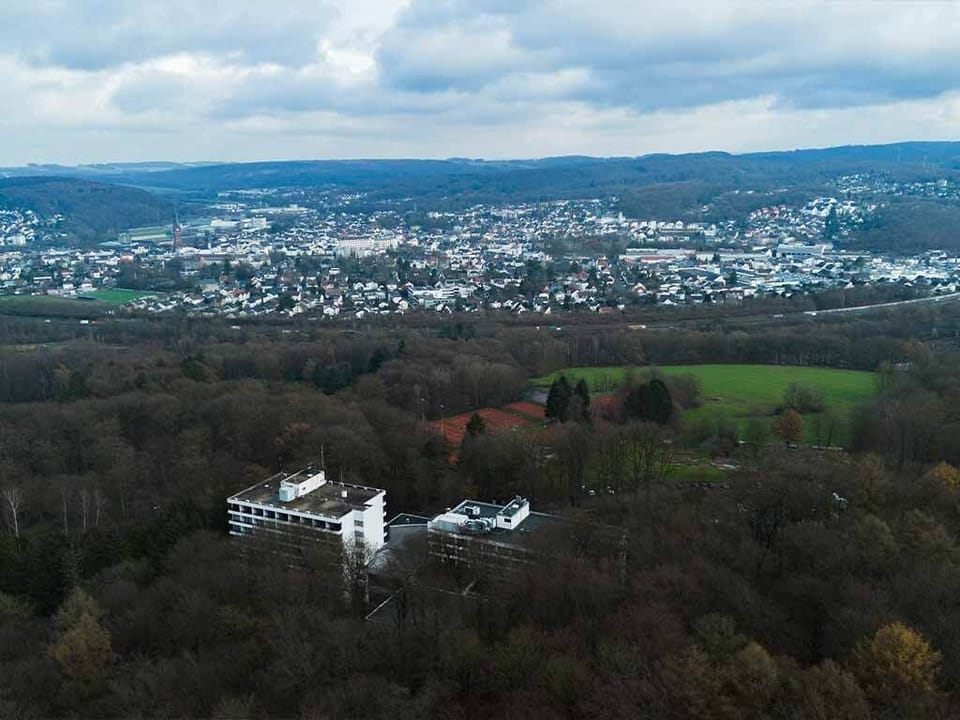 Escape to sweeping valley views beside tranquil forested hills.