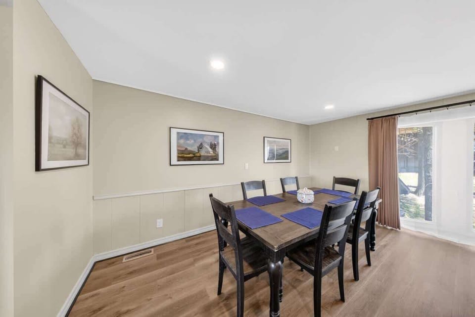 Formal dining for six with natural light and curated artwork