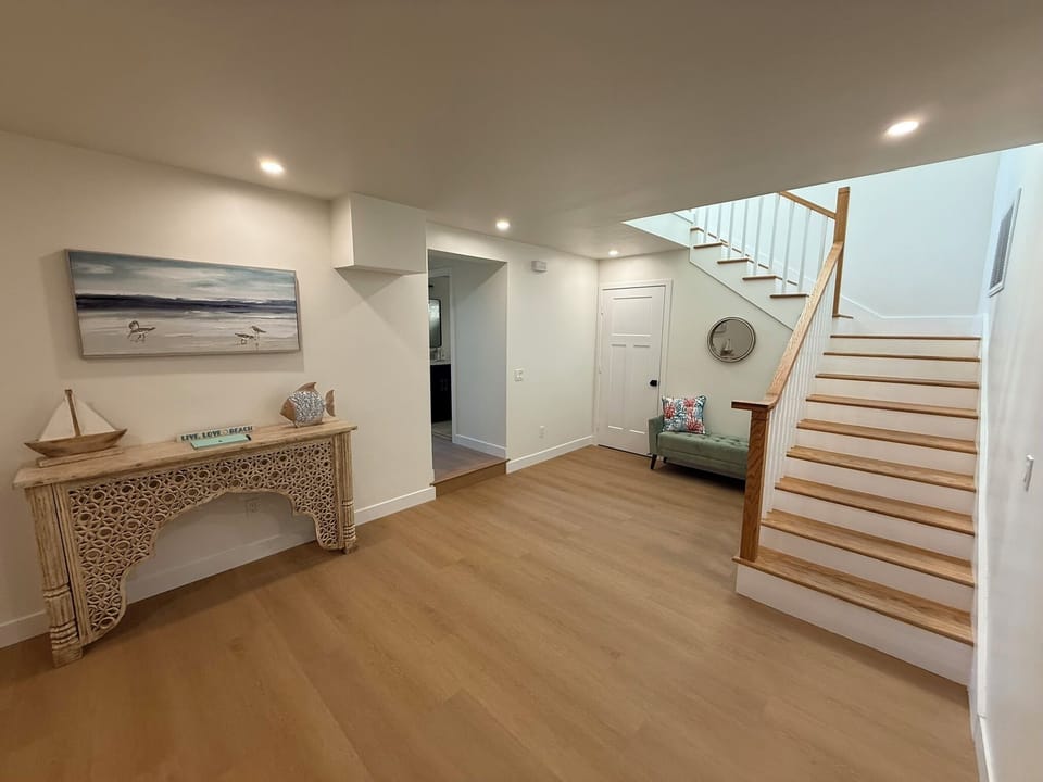 Entryway and stairs to upstairs loft, balcony and bedrooms