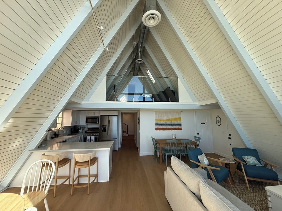 View of kitchen and ocean view loft above