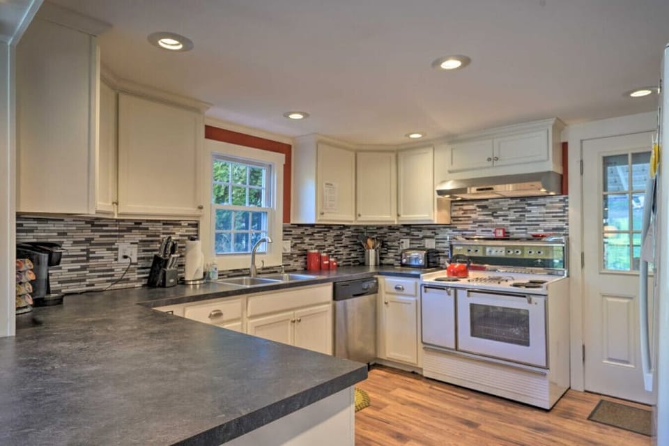 Kitchen | White Cabinetry, Large Prep Counters & Window Over Sink